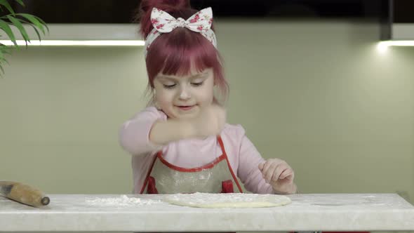 Cooking Pizza. Little Child in Apron Sprinkle the Dough with Flour in Kitchen alt