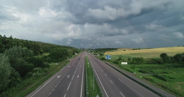 Highway On A Background Of Cloudy Sky With Low Cloud  alt