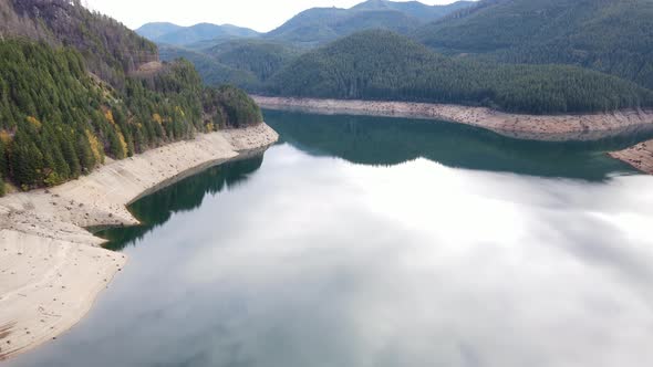 Aerial shot of a reservoir with low water levels alt