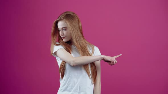 The Charismatic Young Woman Looks Nonchalant and Subtle with Her Finger on One Side and Looks the alt