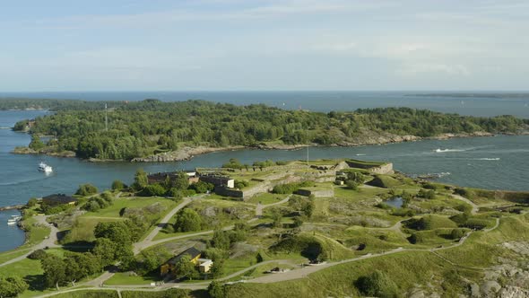 Aerial view overlooking the Kustaanmiekka island, at the Suomenlinna fortress, Vallisaari in the bac alt