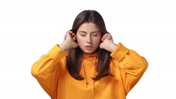 Slowmotion Annoyed Childish and Fedup Bothered Cute Girl Shut Ears with Fingers Unwilling Listen alt