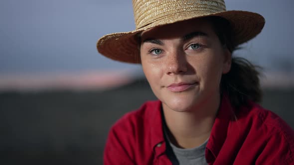 Closeup Portrait of Beautiful Young Woman Looking at Camera Smiling in Slow Motion alt