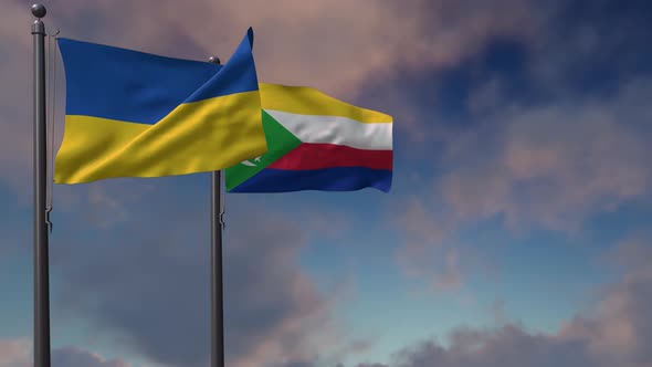Comoros Flag Waving Along With The National Flag Of The Ukraine - 4K alt