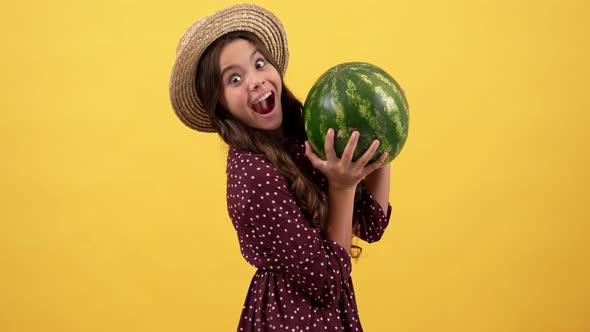 Amazed Kid with Watermelon Fruit on Yellow Background Watermelon alt