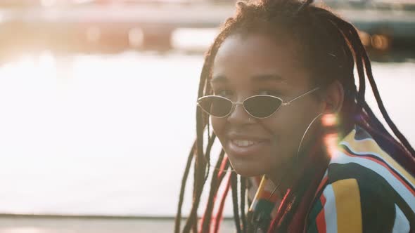 Closeup Shot of Smiling African American Woman Looking at Camera alt
