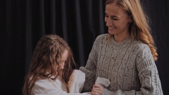 Happy Mom and Daughter Fooling Around