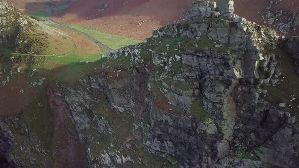 Stunning View Of The Valley Of The Rocks At The Coast In Lynton, England - aerial drone, tilt down s alt