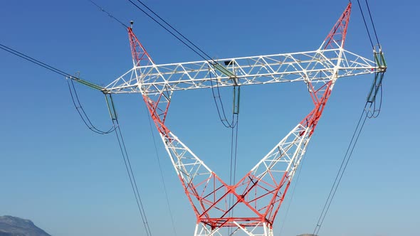 Transmission tower supporting an overhead high voltage power line from generating station alt