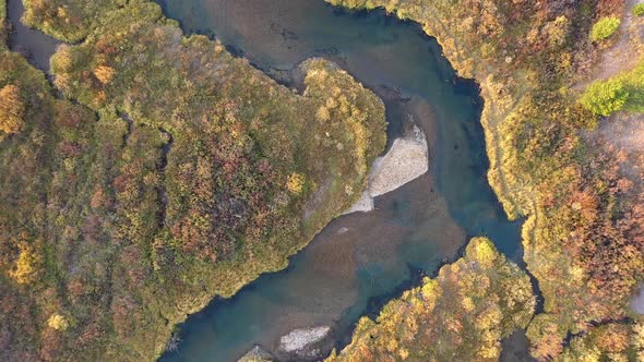 Aerial view looking down at the Madison River in Fall color alt
