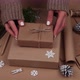 Woman packing Christmas gifts in brown paper - VideoHive Item for Sale