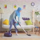 Muslim Woman in Hijab Doing House Cleaning with a Vacuum Cleaner