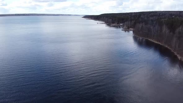 Aerial View of the Vuoksi River, the Forest and the Settlement in Autumn Day, Losevo, Leningrad