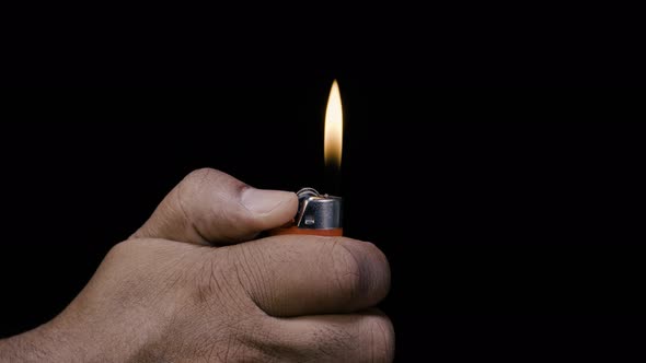 Indian Hand with a Red Lighter