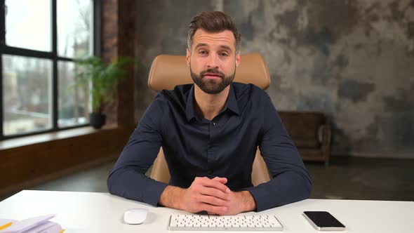 Young Bearded Confident Entrepreneur Man in Business Casual Clothes Looking at Camera