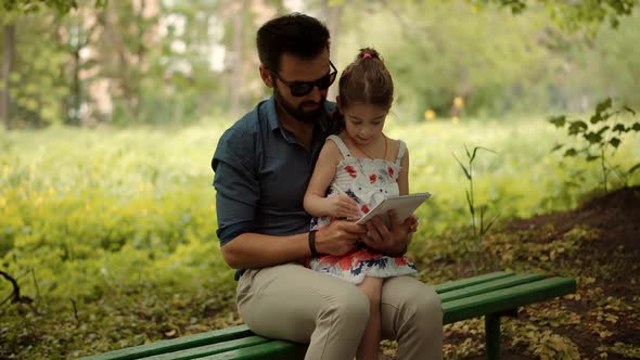 Preschool Child With Dad Learning Drawing Picture. Kid Sitting With Father And Draws On Notepad. alt