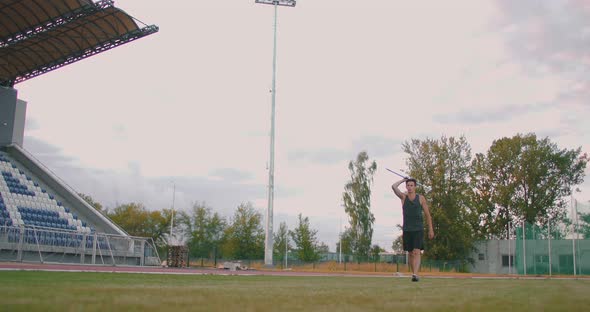 Javelin Throw Back Athlete Thrower in Track and Field Event. Undefined Athlete Javelin Throwing alt