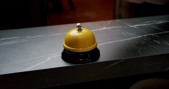 A Woman Hand Presses Bell Button alt