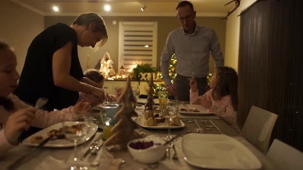 Family of Five During Christmas Dinner at Home