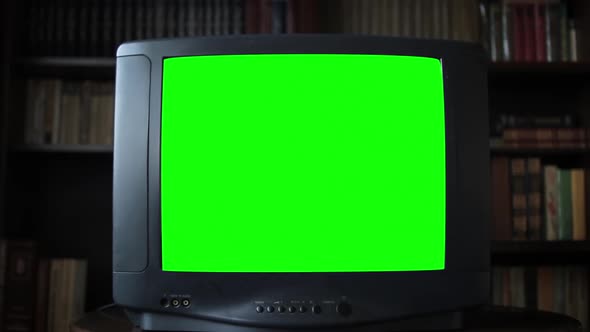 Vintage Analog Television with Green Screen in Room