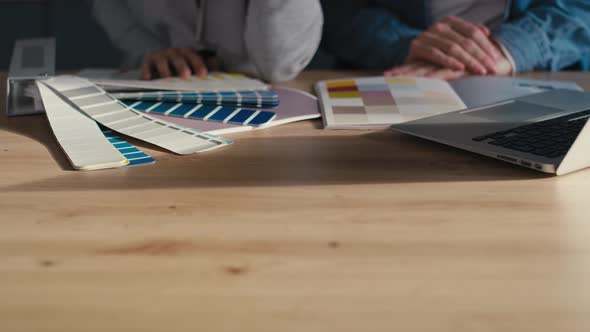 Detail of couple choosing colors for new house. Shot with RED helium camera in 8K. alt