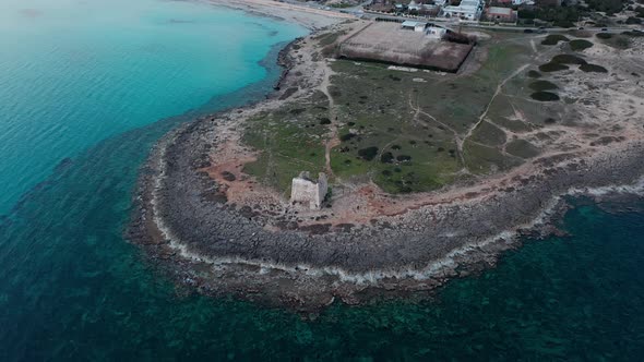 Medieval tower on the sea, Puglia, Italy. Aerial landscape