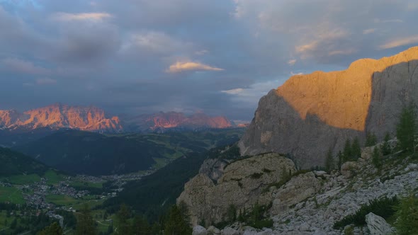 Awesome illuminated South Tyrol rocky mountain landscape aerial reverse view of sunset glowing on ru alt