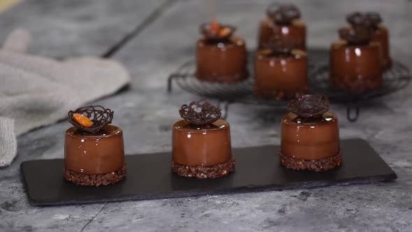 Pastry Chef Decorate a Chocolate Mousse Dessert with Caramel Almond