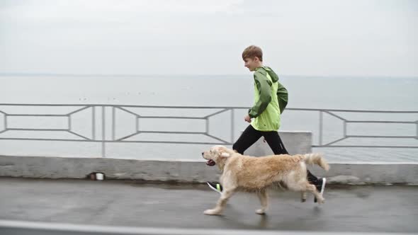 Young Owner having Walk Time Fun with Dog alt