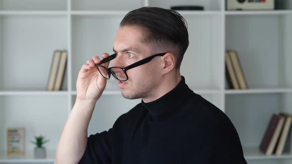 Portrait of Shocked Male Businessman in Takes Off Glasses and Say What alt