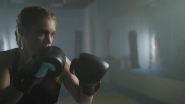 Woman Power Female Fighter Trains His Punches Beats a Punching Bag Training Day in the Boxing Gym alt