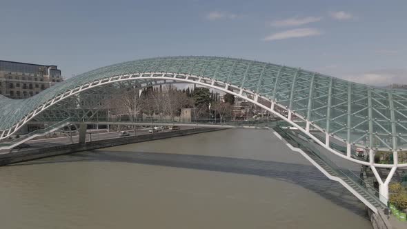 Tbilisi, Georgia - April 2 2021: Aerial view of Tbilisi city central park and Bridge of Peace. alt
