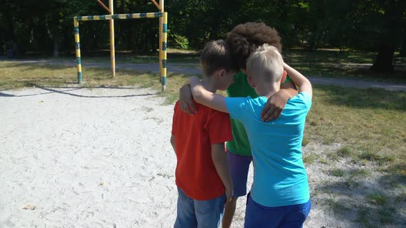 Ritual Before Game, Boys Hugging and Discussing Game Strategy, Football Match