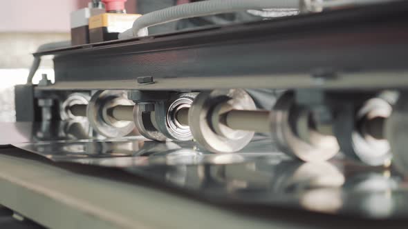 A Machine That Cuts a Metal Plate. Metal Processing in Production. Creation of Ventilation Boxes. alt