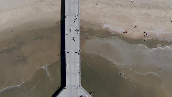 Aerial Top View of Huntington Pier, Beach and Coastline During Sunny Summer Day alt