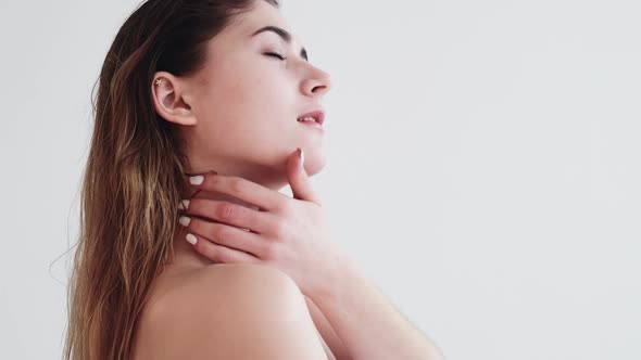 Skincare Treatment Woman Touching Bare Shoulder alt