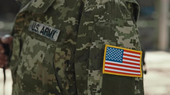 Close Up of Soldier with US Patch Flag on Army Uniform alt