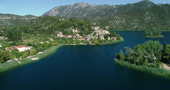 Aerial view of kitesurfing spot on the Neretva delta valley river. alt