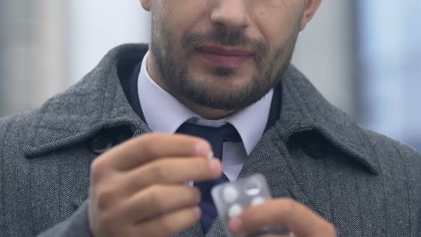 Man Taking Painkiller for Headache Touching Head, Pain Grimace on Face Close-Up