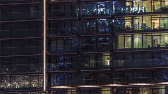 Flat Night Panorama of Multicolor Light in Windows of Multistory Buildings Aerial Timelapse alt