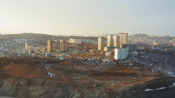 Aerial View of Modern Highrise Building in Vladivostok City at Sunset alt
