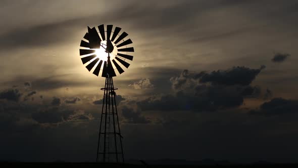 Windmill Against A Setting Sun alt