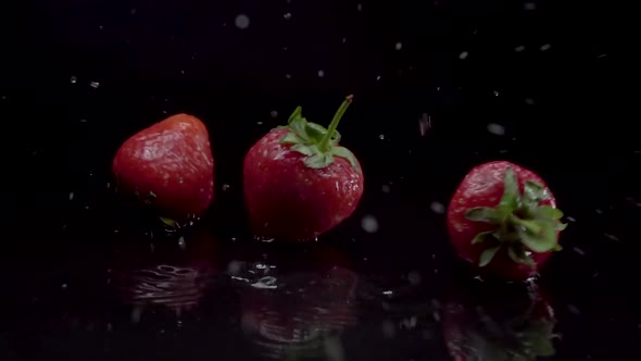 Strawberry Slow Motion Closeup Falling in Water with Splash Droplets alt