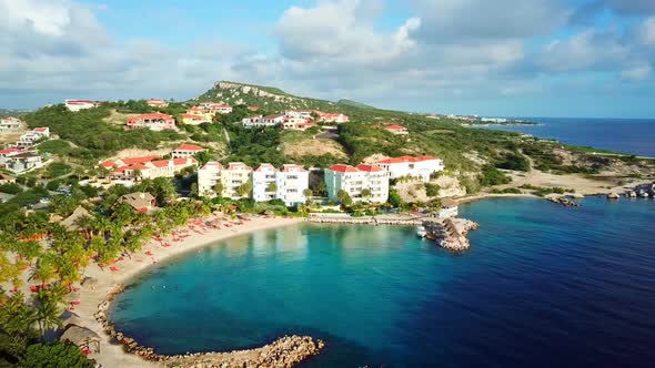 Aerial orbit of the Blue Bay of Curacao, Dutch Caribbean island, resort of golf on a sunny day. alt