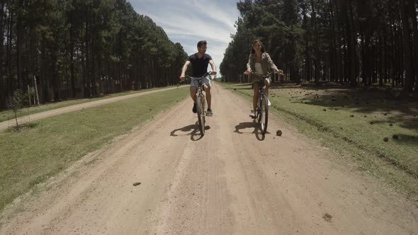 Young couple riding bicycles
