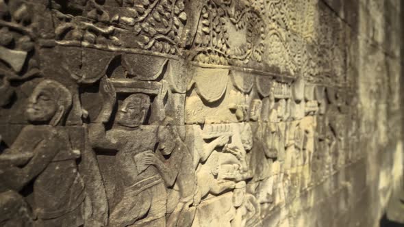 Close-up Ornate Details of Ancient Stone Bas-Relief in a Temple in Angkor, Cambodia alt