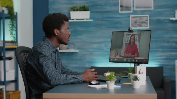 Remote Worker Working From Home Talking on Online Conference Internet Video Call with Coworker alt