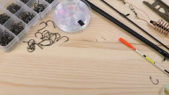 Fishing Equipment on Wooden Table