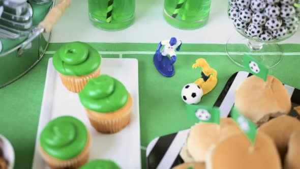 Kids football party set with snacks and drinks. alt