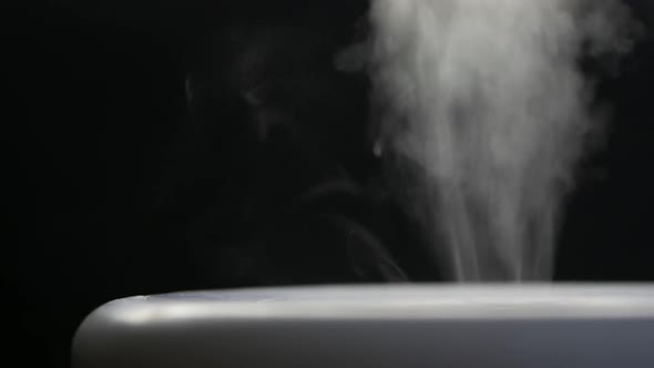 White Steam of Ultrasonic Humidifier. Frume of Vapor From Diffuser for Air Moisturize. Loop Endless alt